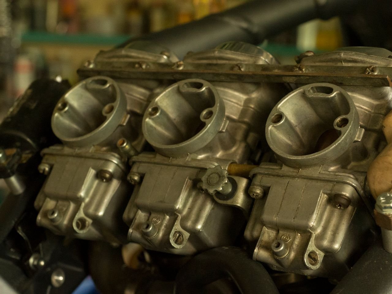 The Art of Drawing Readers In: Your attractive post title goes here Detailed view of a carburetor, showcasing mechanical precision and engineering.