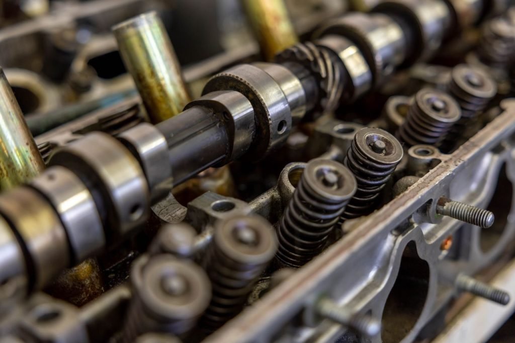 Detailed view of an engine camshaft and valve springs, showcasing mechanical precision.