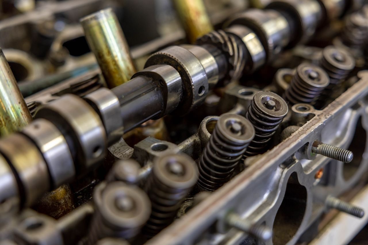 Mastering the First Impression: Your intriguing post title goes here Detailed view of an engine camshaft and valve springs, showcasing mechanical precision.