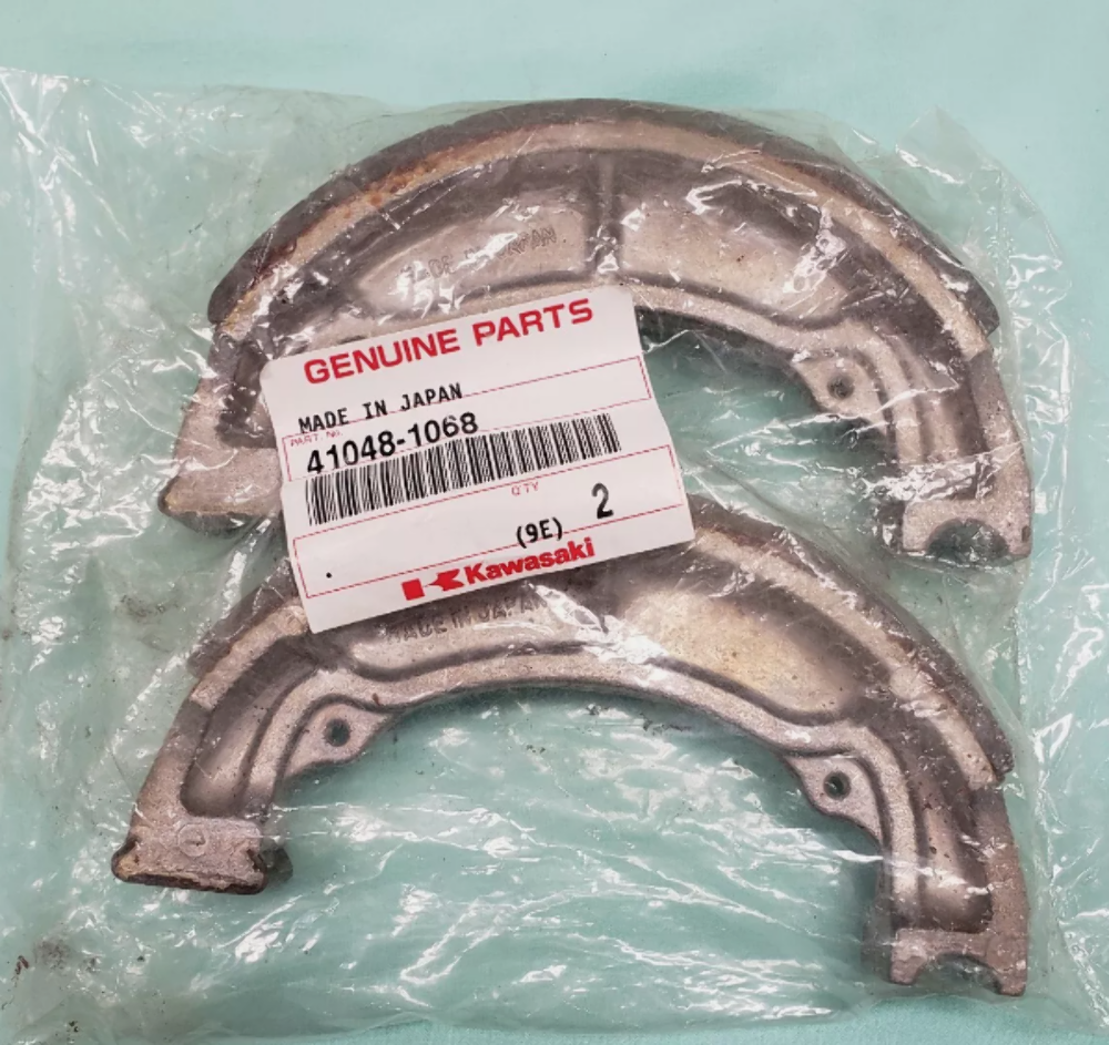 KAWASAKI NOS OEM Rr/Frt Brake Shoe 83-11 KLT KDX KLF KSF KFX 41048-1068