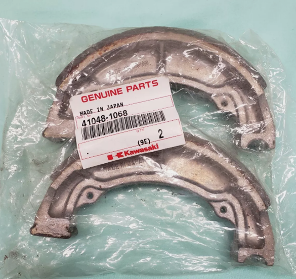 KAWASAKI NOS OEM Rr/Frt Brake Shoe 83-11 KLT KDX KLF KSF KFX 41048-1068