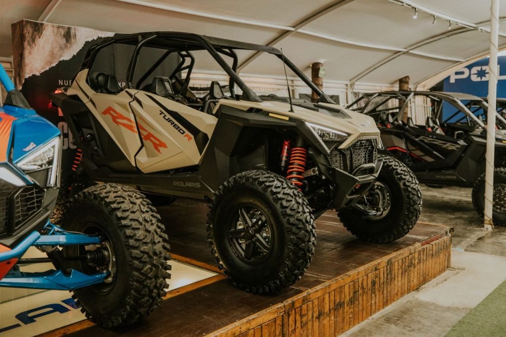 A powerful RZR Turbo R showcased indoors, perfect for off-road adventures.